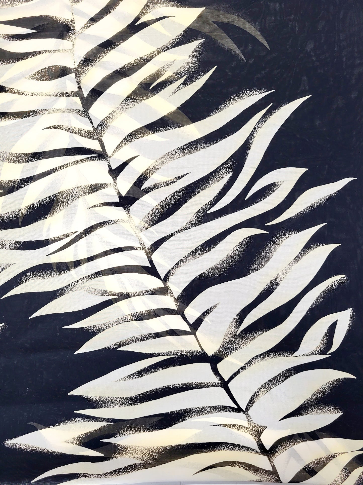 Circular scarf with fern print on a black background