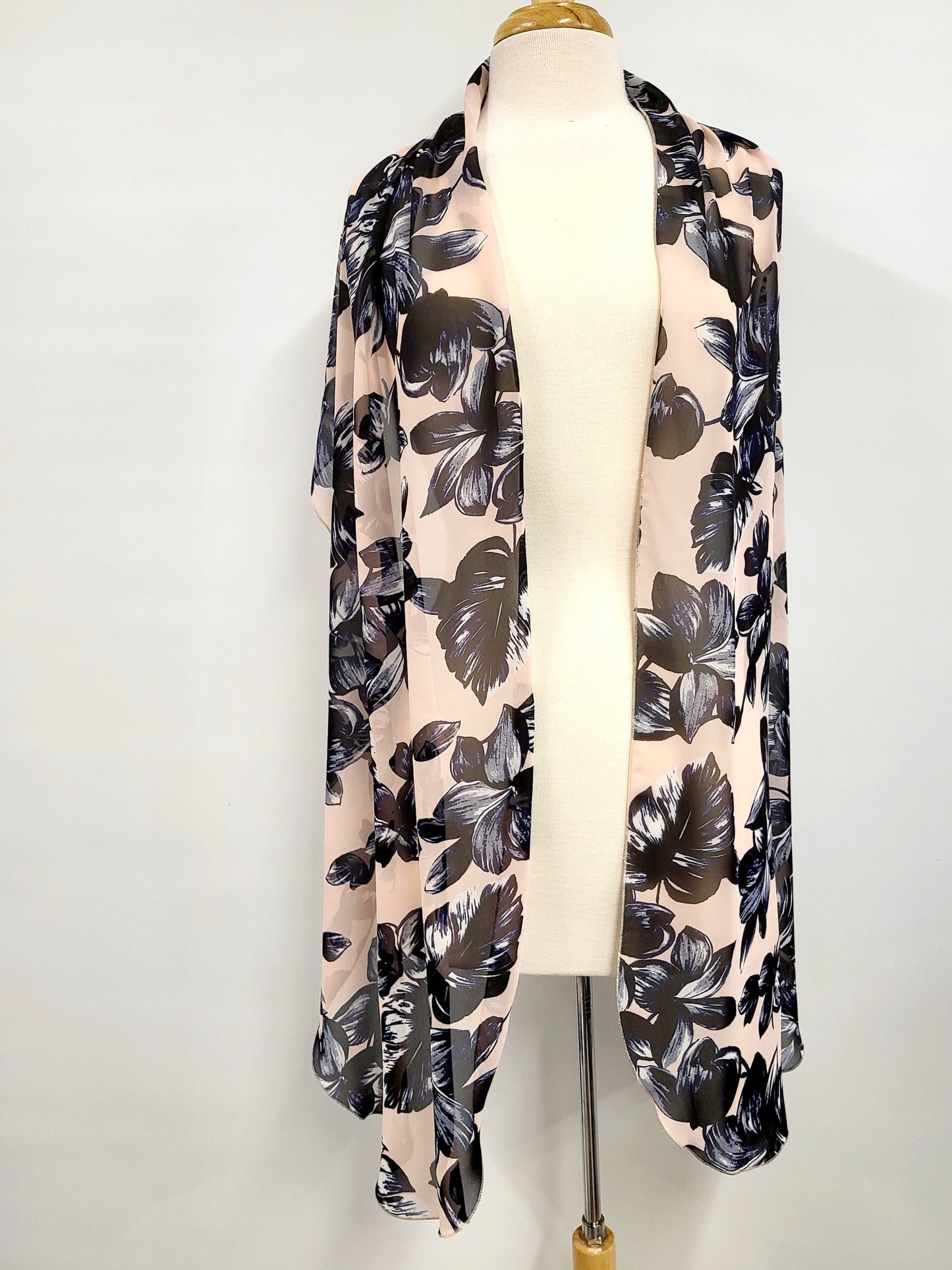 Long voile scarf printed with navy flowers on a pink background