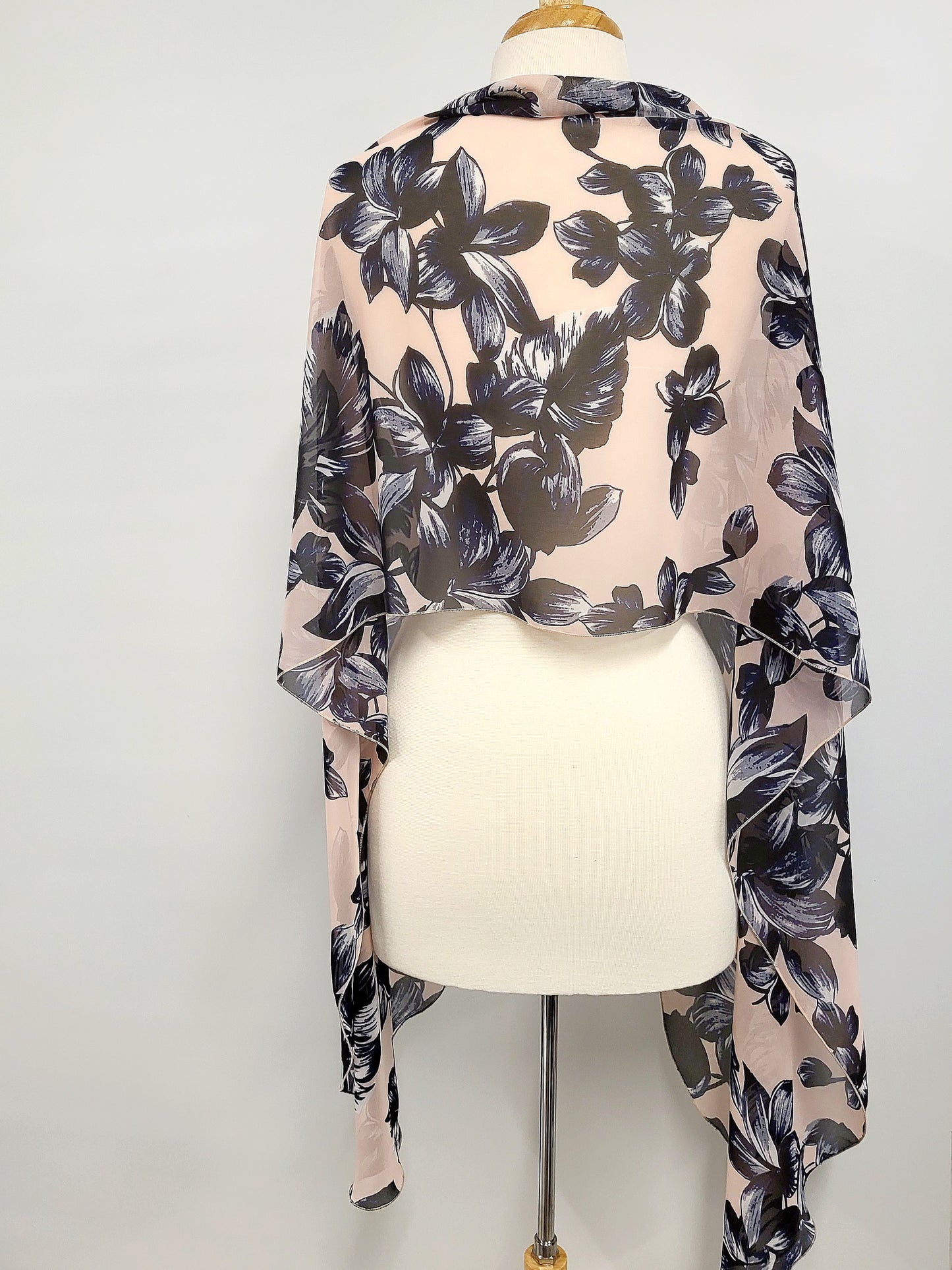 Long voile scarf printed with navy flowers on a pink background