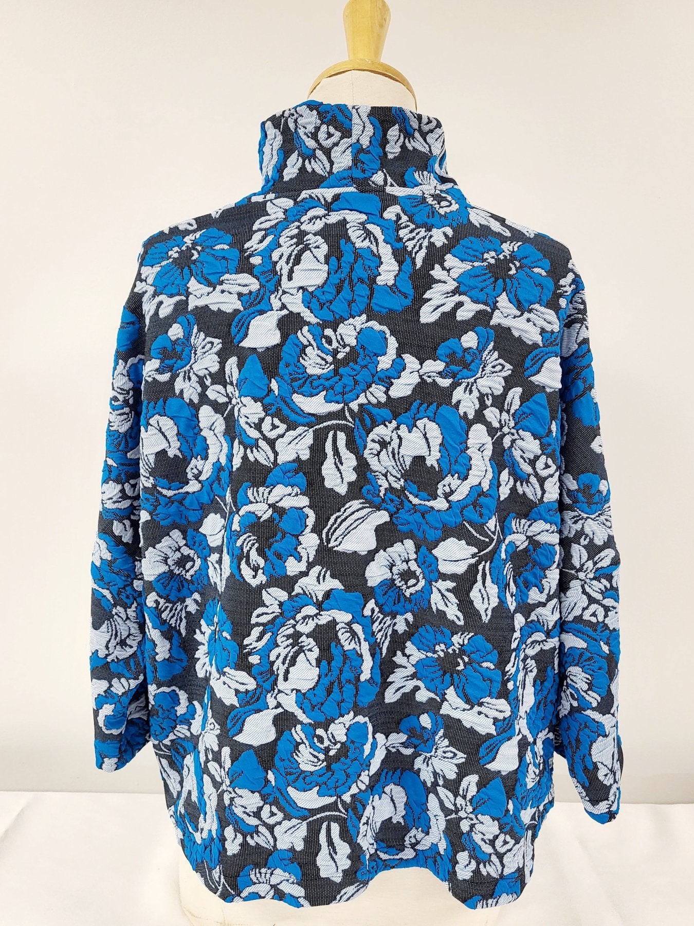 Julie Top - loose-fitting with high neck and pockets in turquoise, gray and black knit.