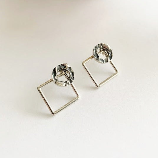 SEY - Sterling silver donut and diamond ear jackets.