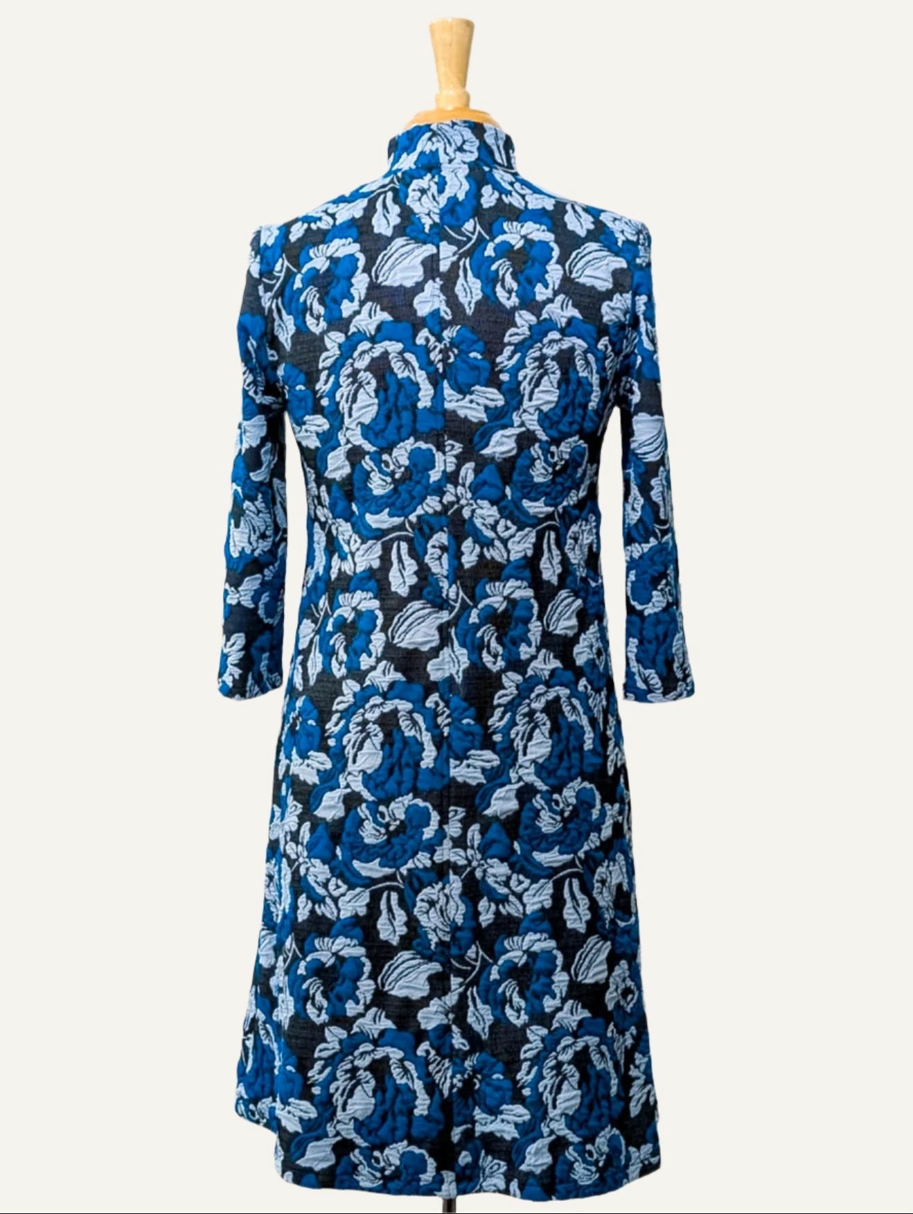'Christine' three-quarter sleeve high neck dress in turquoise floral knit