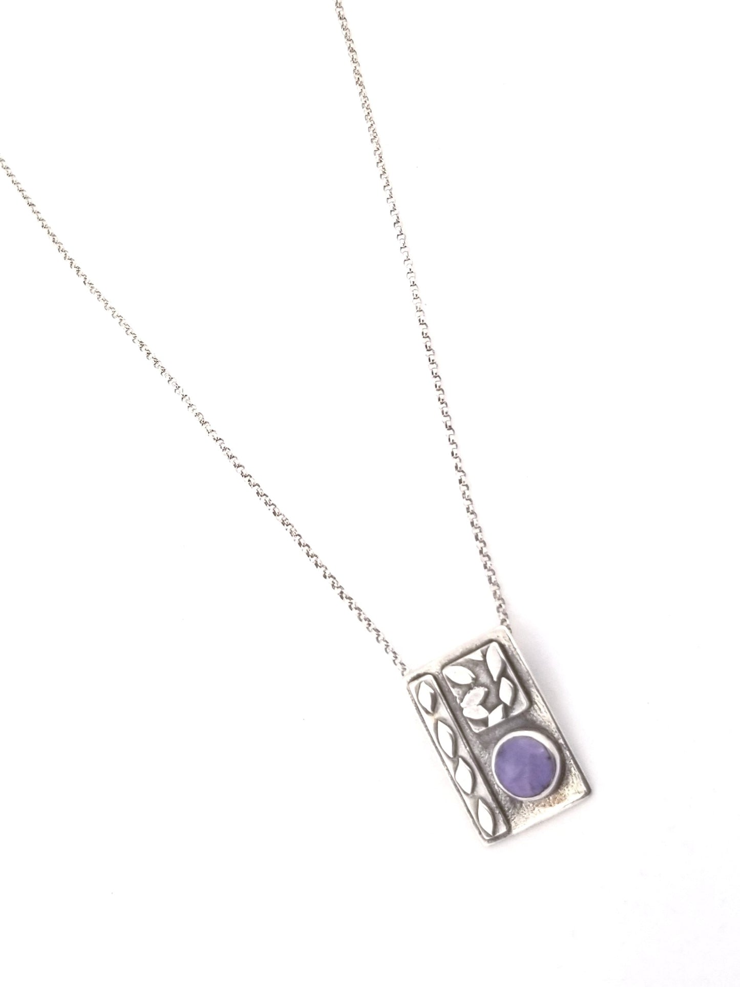 Necklace with small silver leaves and natural purple stone