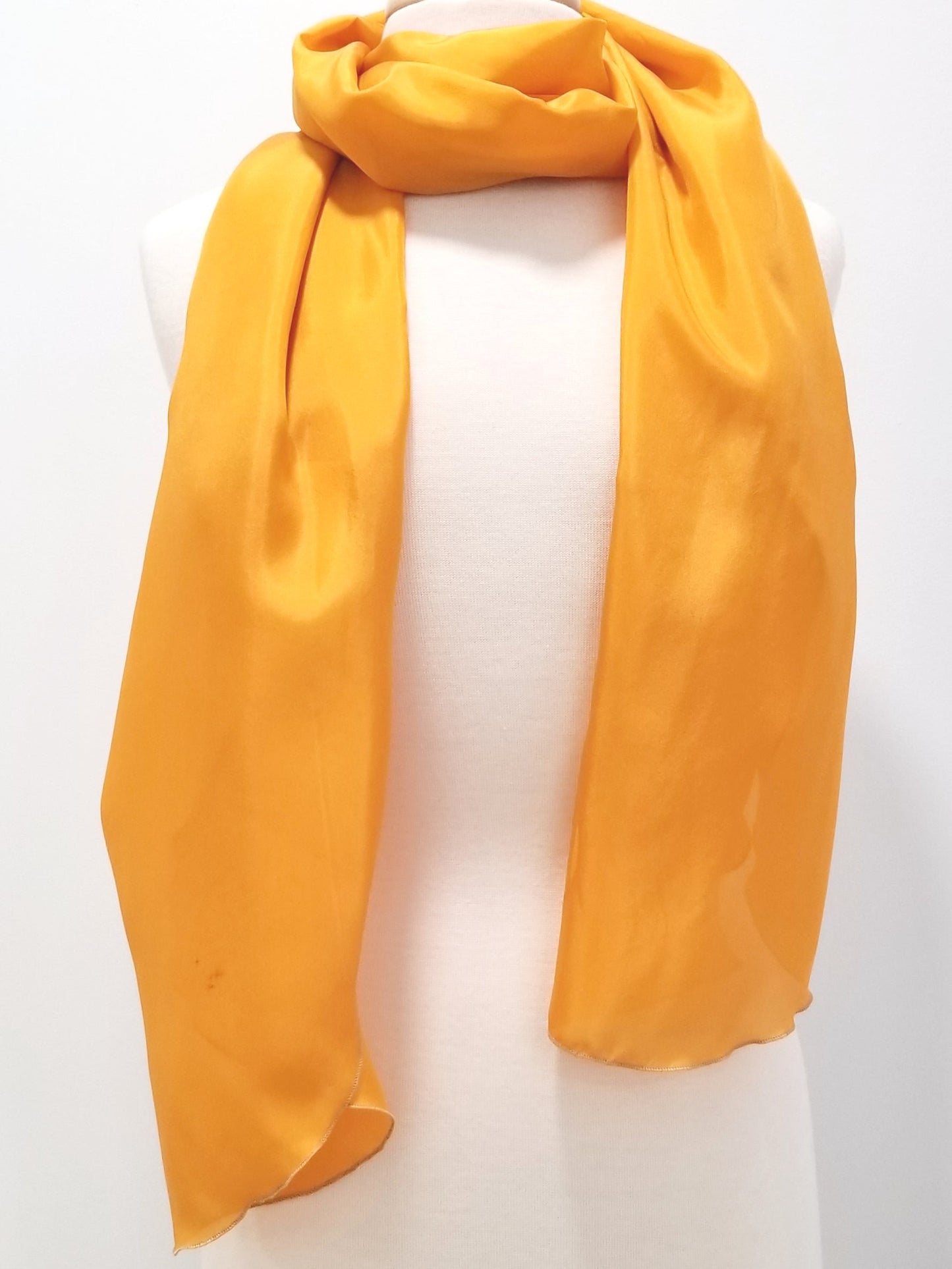 Long, lightweight yellow silk scarf.
