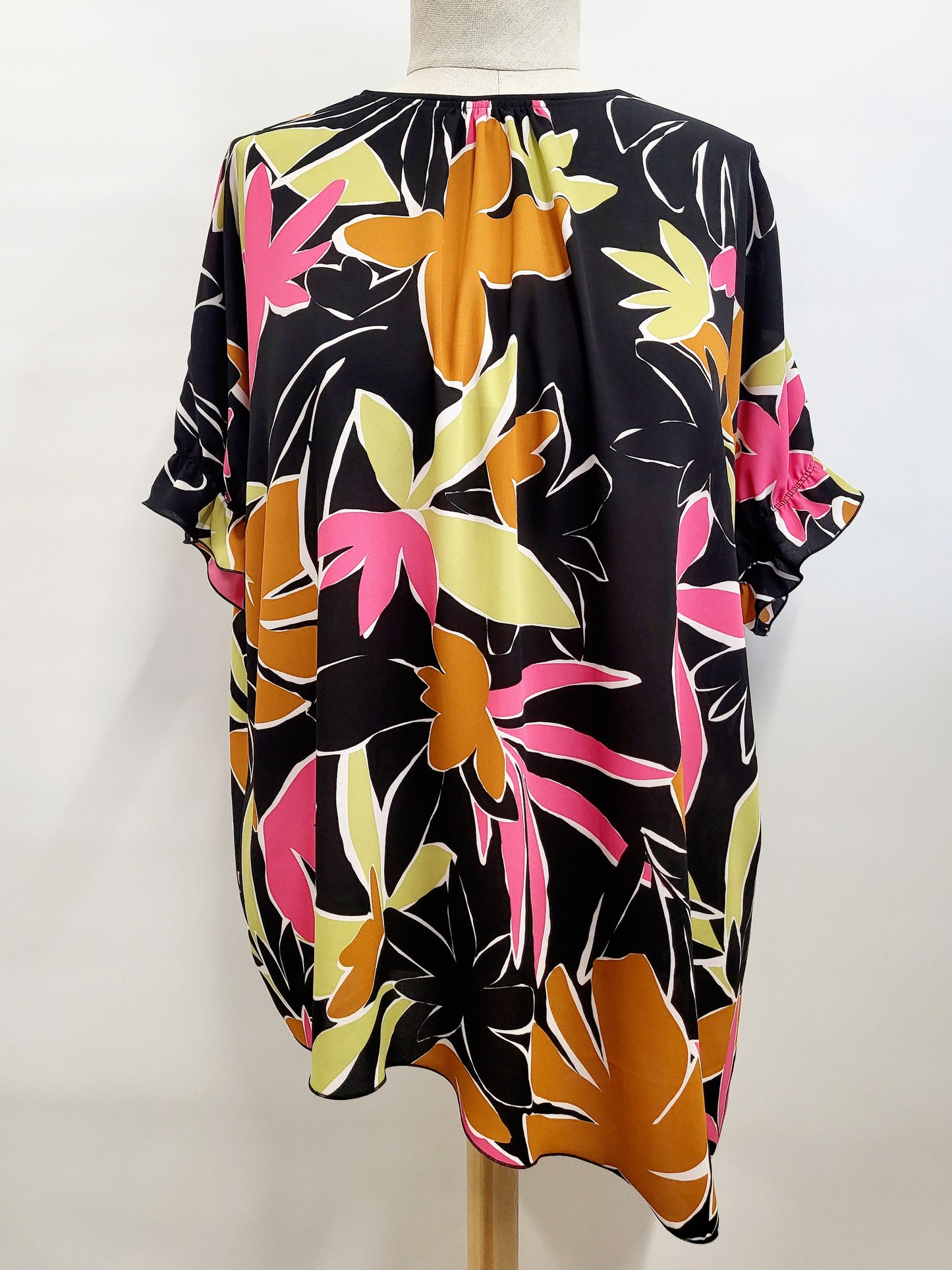Asymmetrical Hélène tunic, tropical foliage print on a black background