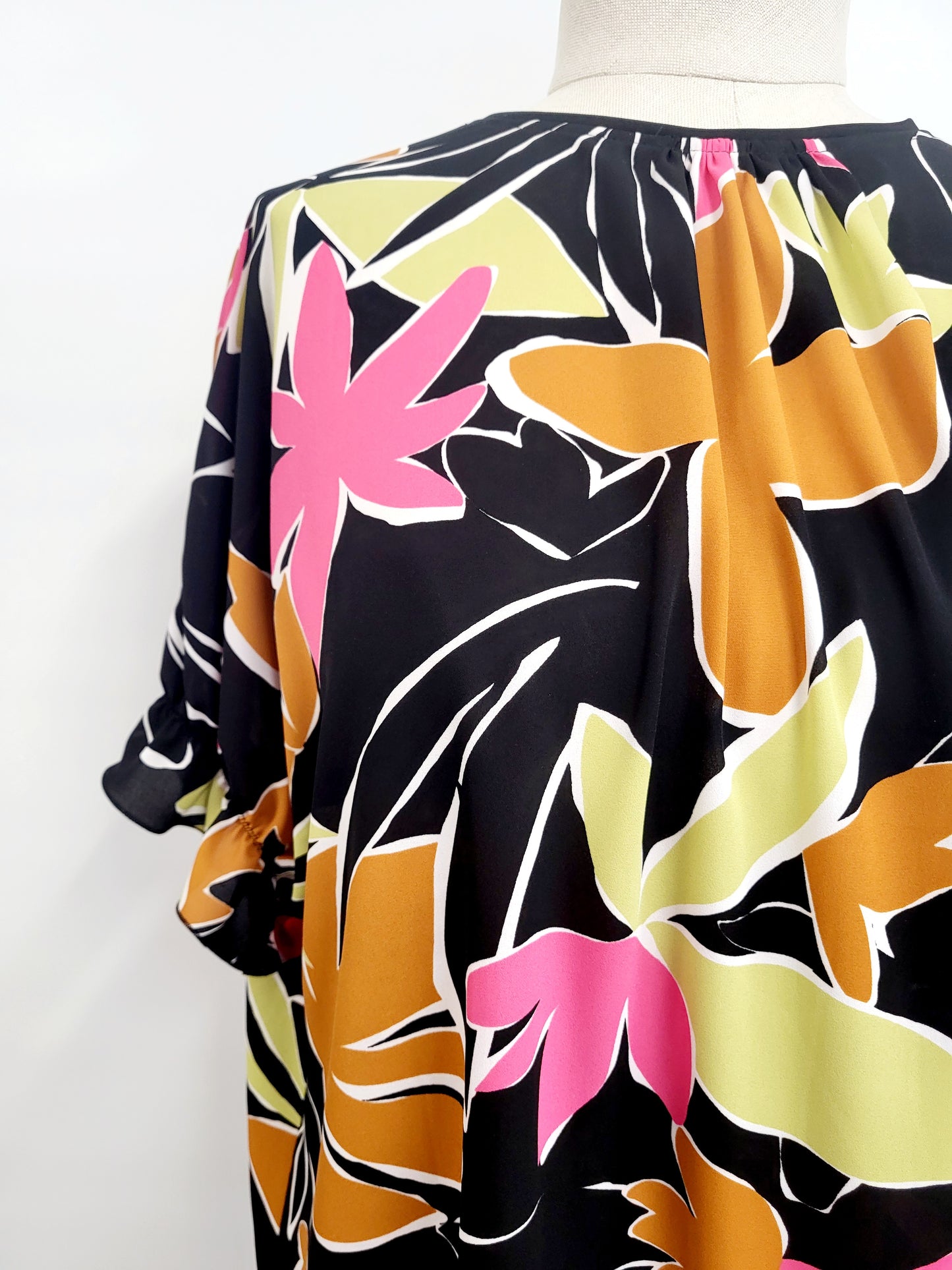 Asymmetrical Hélène tunic, tropical foliage print on a black background