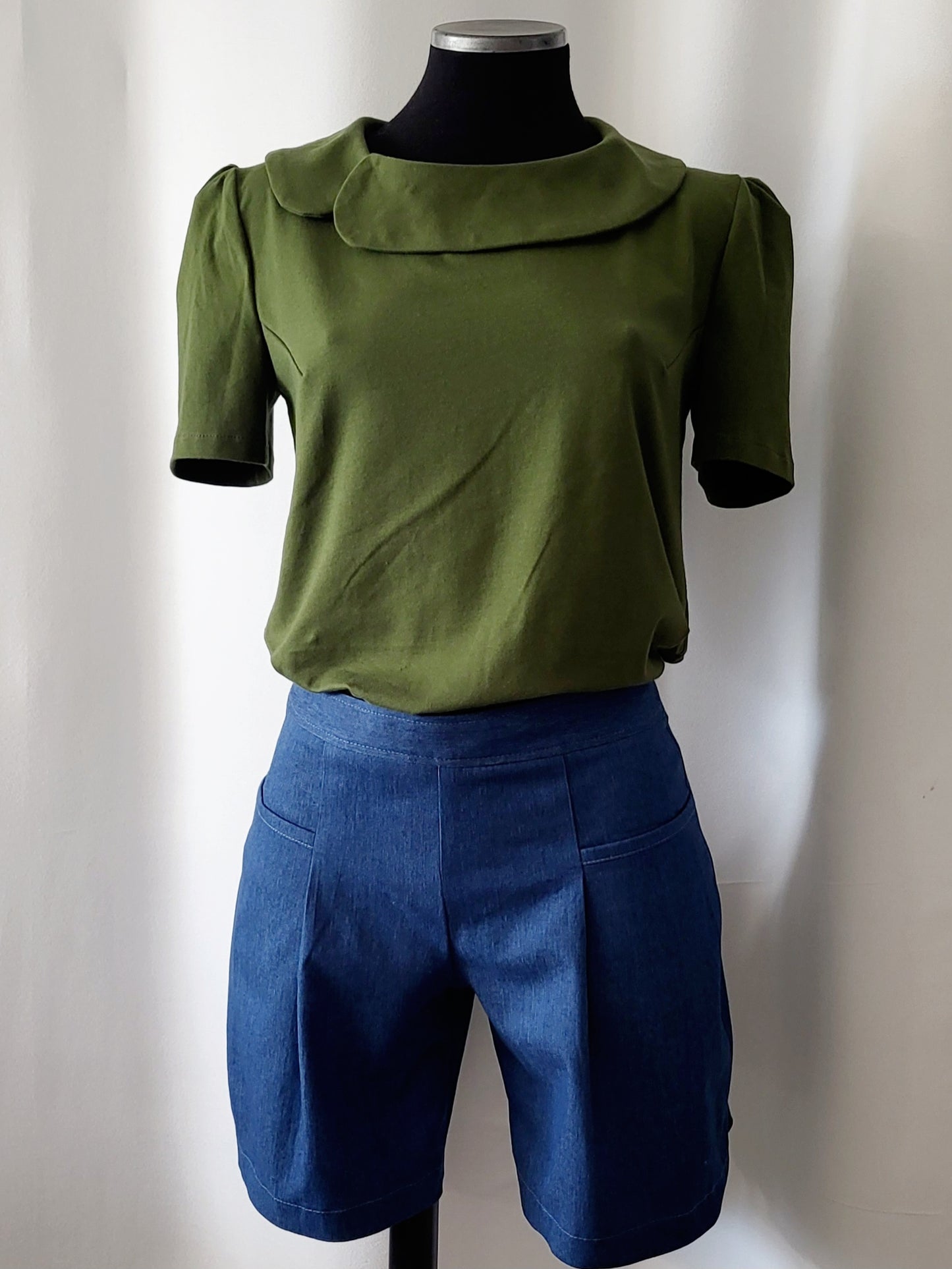 Julie Top - loose-fitting with high neck and pockets in turquoise, gray and black knit.