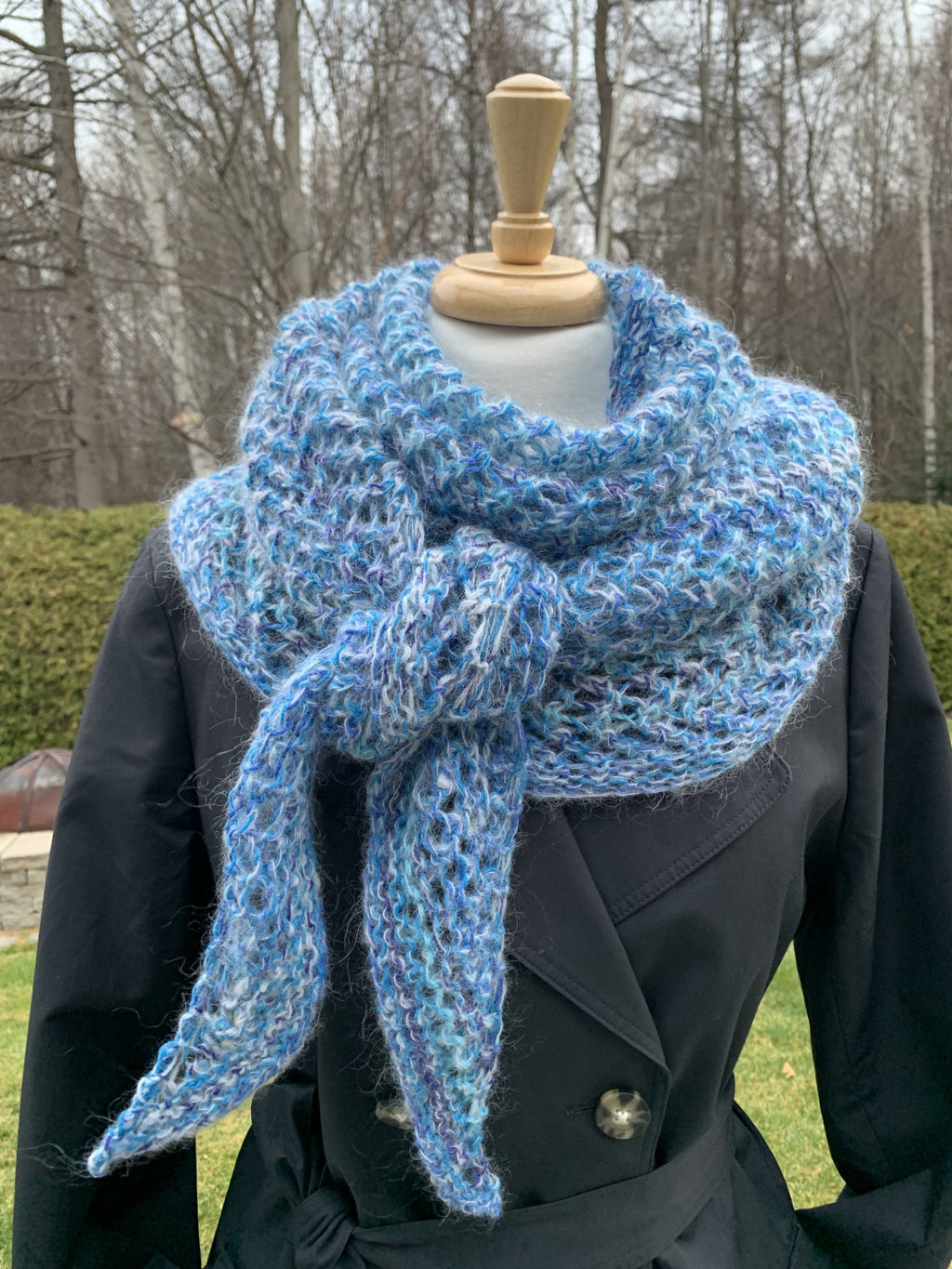 Crochet knitted shawl in shades of blue, contains mohair
