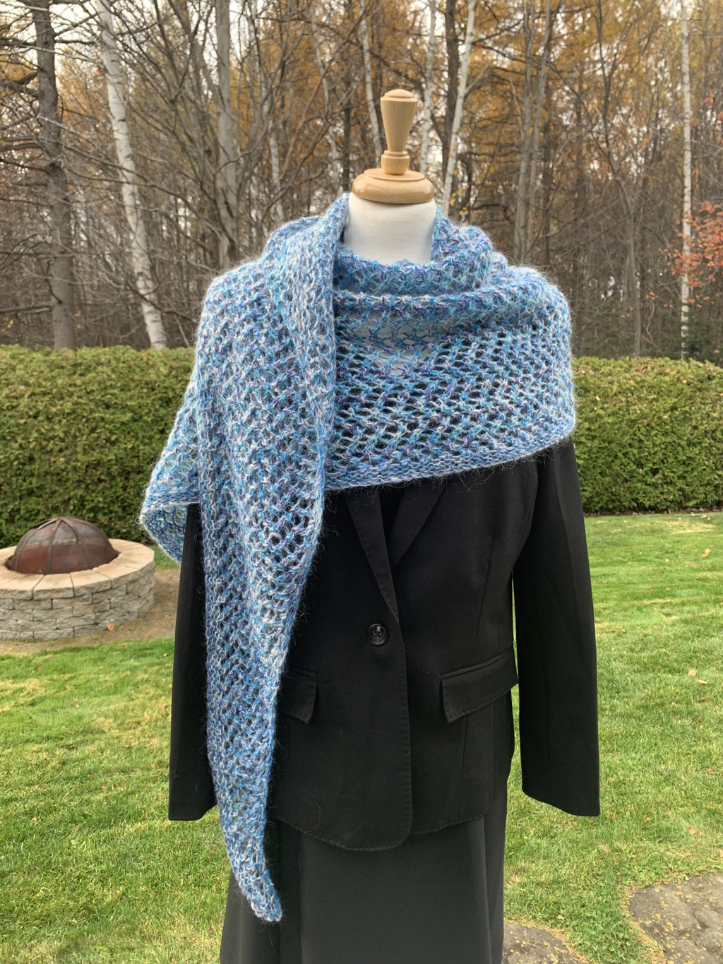 Crochet knitted shawl in shades of blue, contains mohair