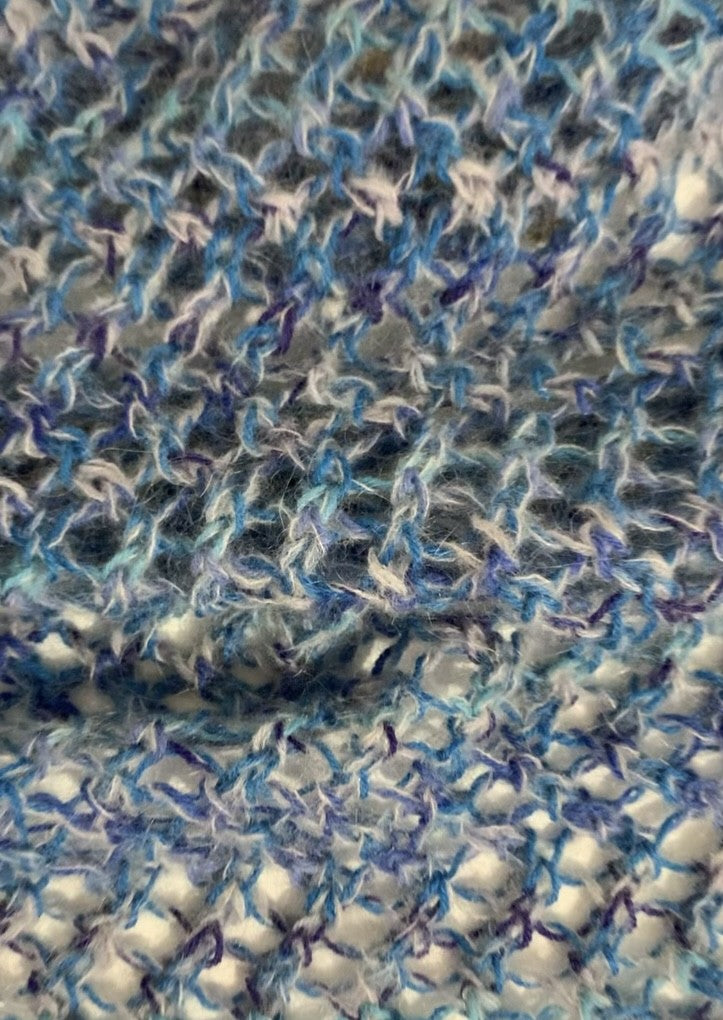 Crochet knitted shawl in shades of blue, contains mohair