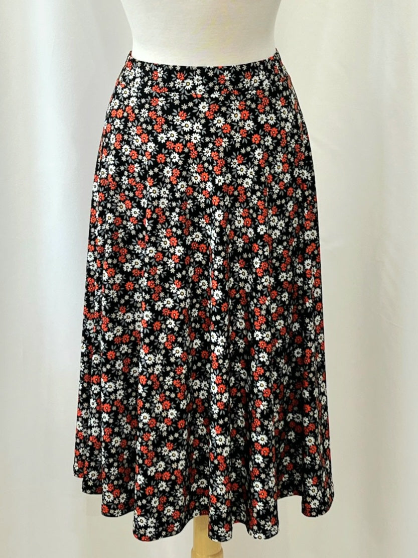 Mid-length flared skirt in printed electric blue.
