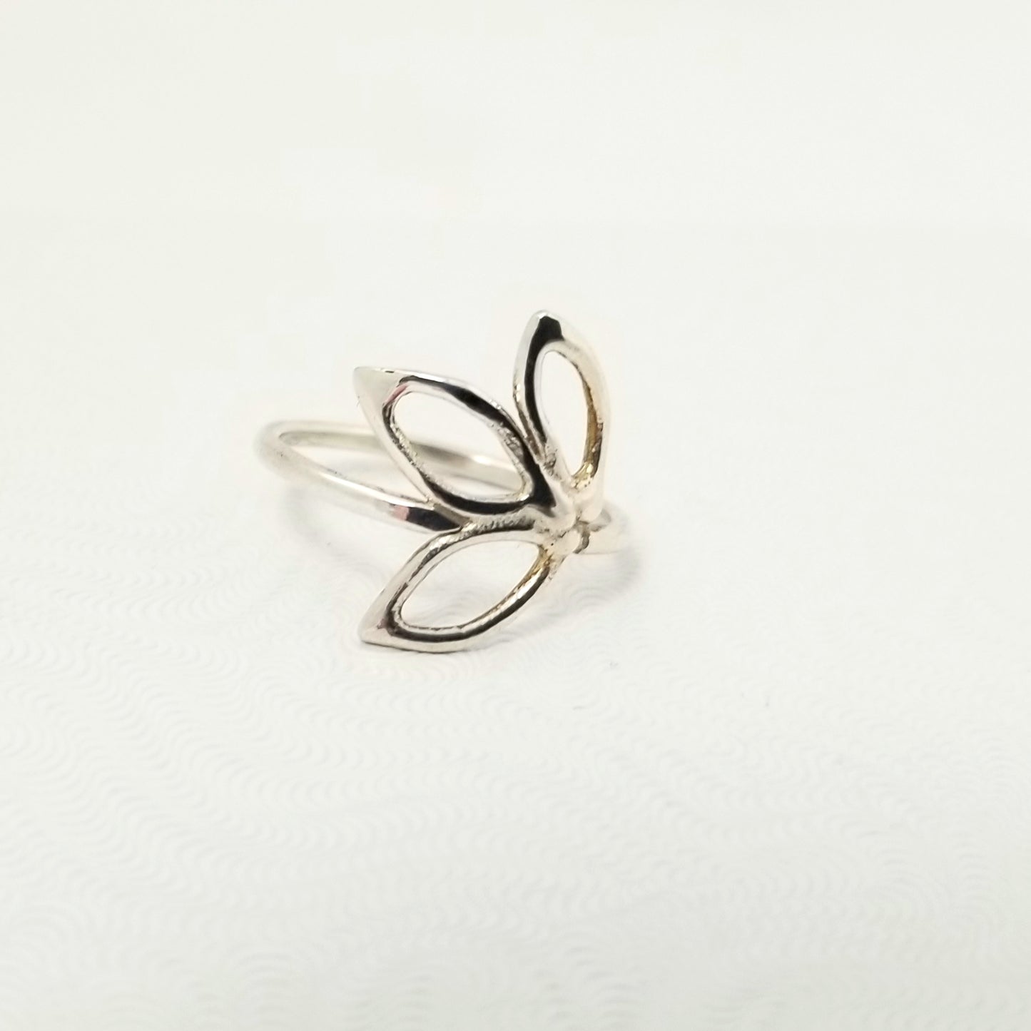 Delicate silver ring with three openwork leaves