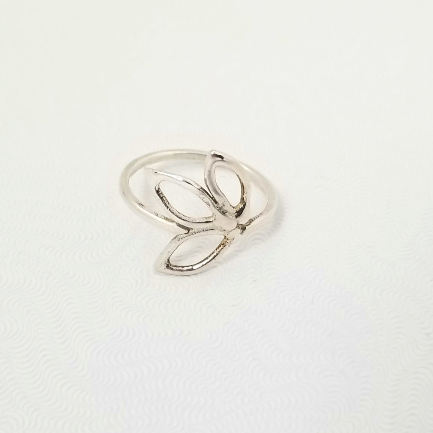 Delicate silver ring with three openwork leaves