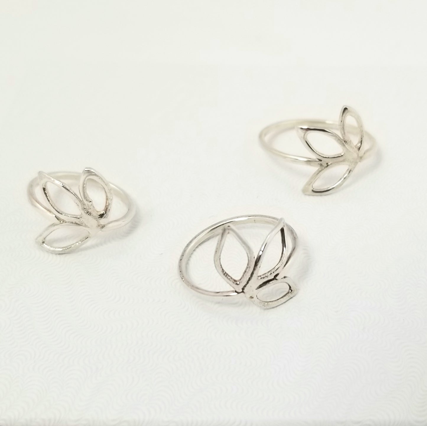 Delicate silver ring with three openwork leaves