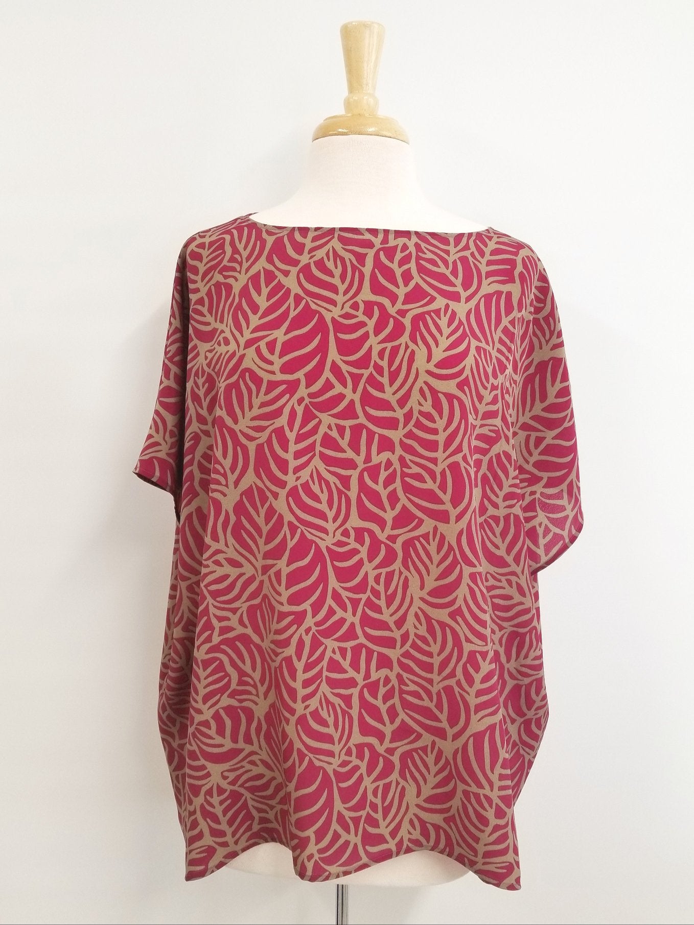 Loose and flowing tunic, magenta and beige foliage print.