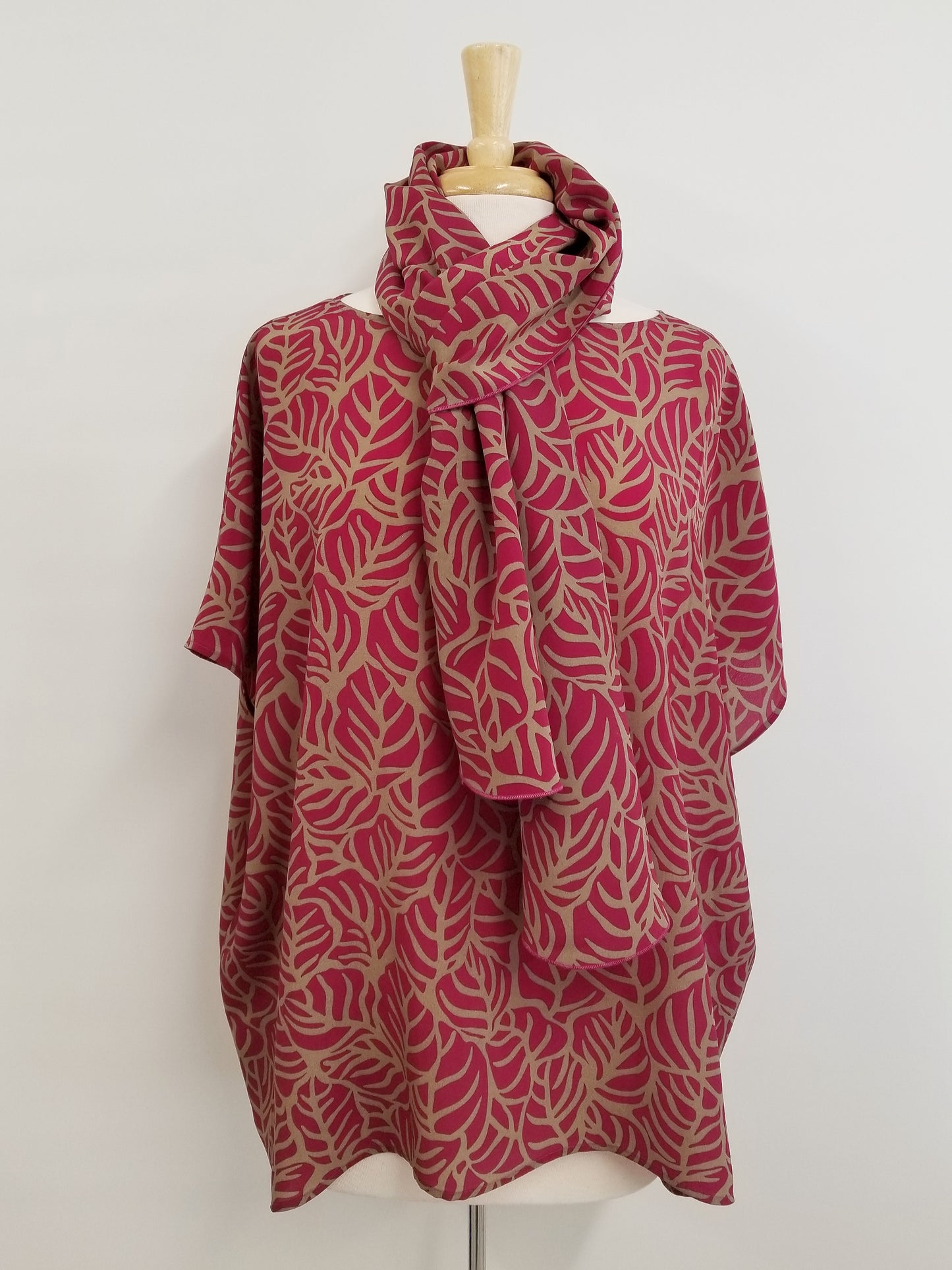 Loose and flowing tunic, magenta and beige foliage print.