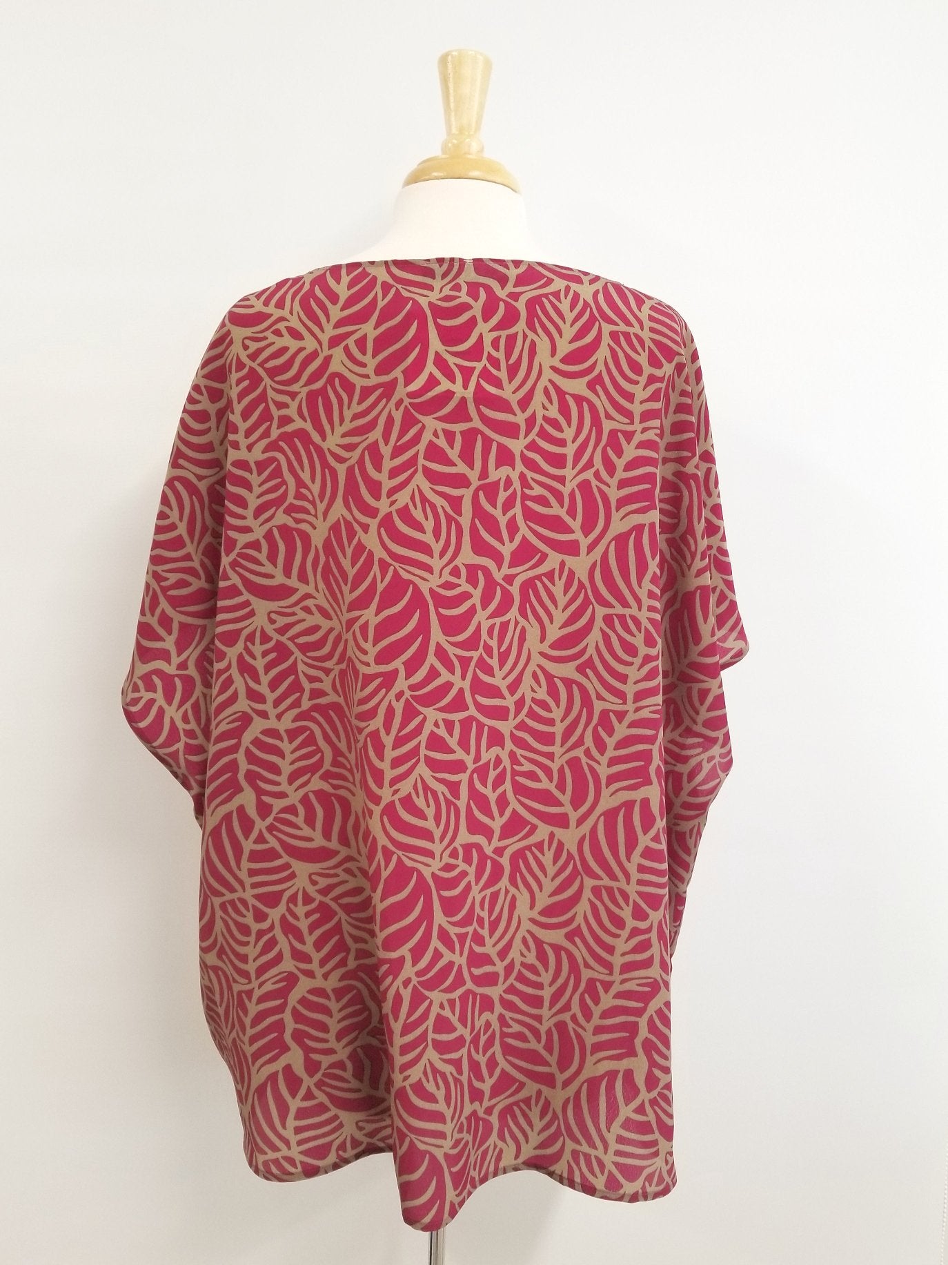 Loose and flowing tunic, magenta and beige foliage print.