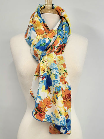 Foulard long fleuri en tons de bleu, jaune et orange