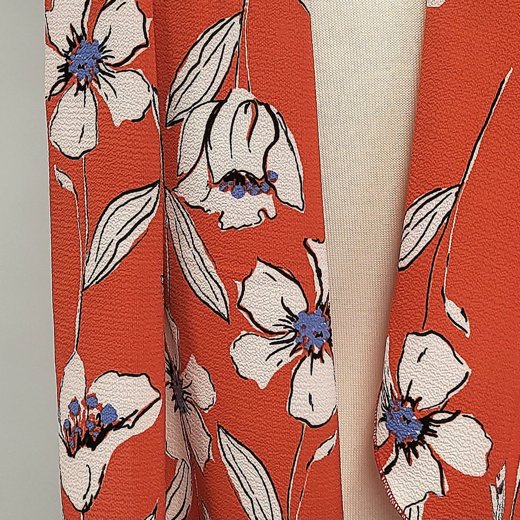 Long scarf with white flowers on a red background